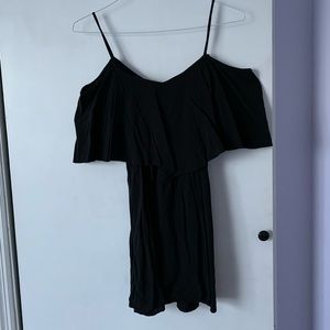 Black off the shoulder dress.